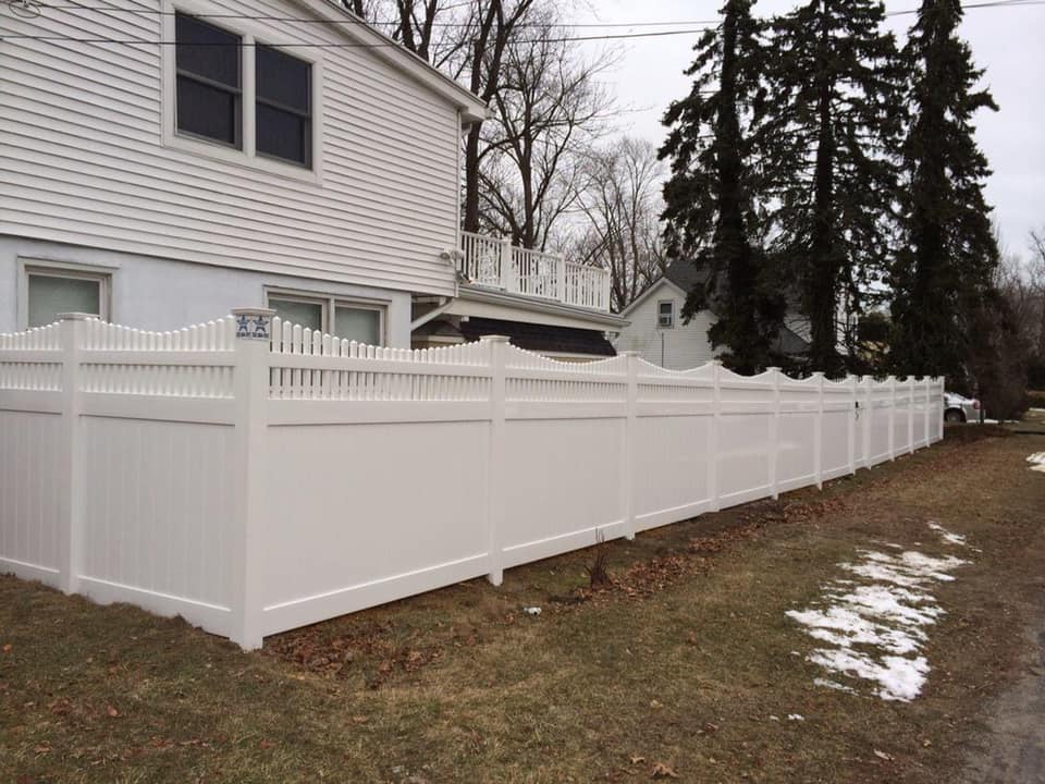 White Vinyl/ PVC Fence Around A House
